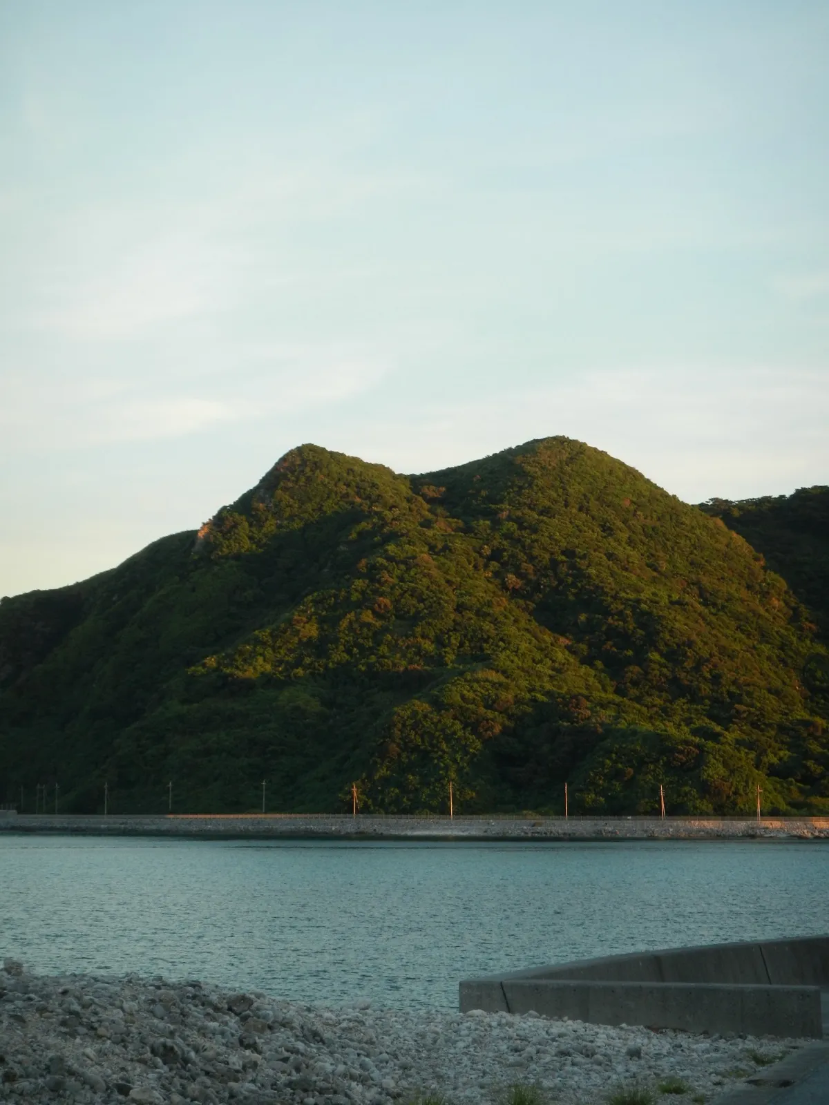Green mountain above the sea on the Japanese coast